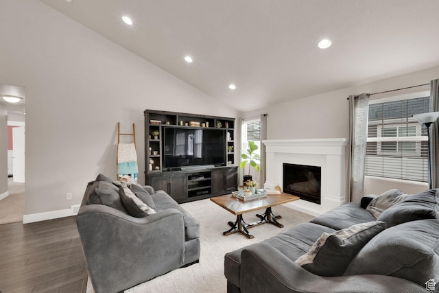 143 E 1825 N, North Ogden, UT 84414 - living area with a glass covered fireplace, vaulted ceiling, recessed lighting, wood finished floors, and baseboards