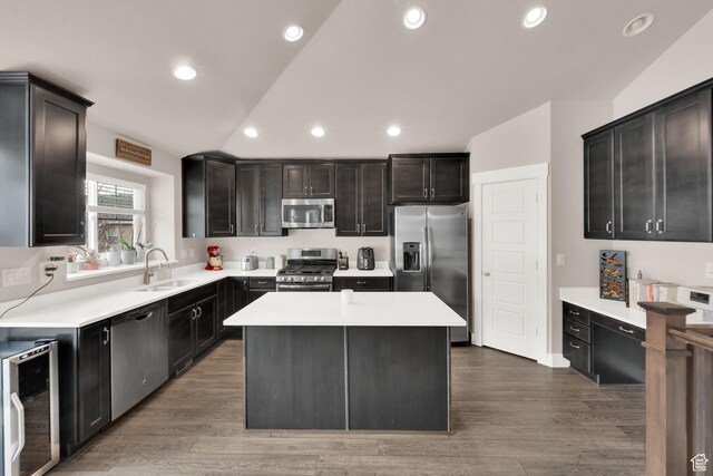 143 E 1825 N, North Ogden, UT 84414 - kitchen with appliances with stainless steel finishes, beverage cooler, light countertops, a center island, and recessed lighting