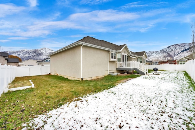 143 E 1825 N, North Ogden, UT 84414 - snow covered property featuring a fenced backyard, a mountain view, and stucco siding