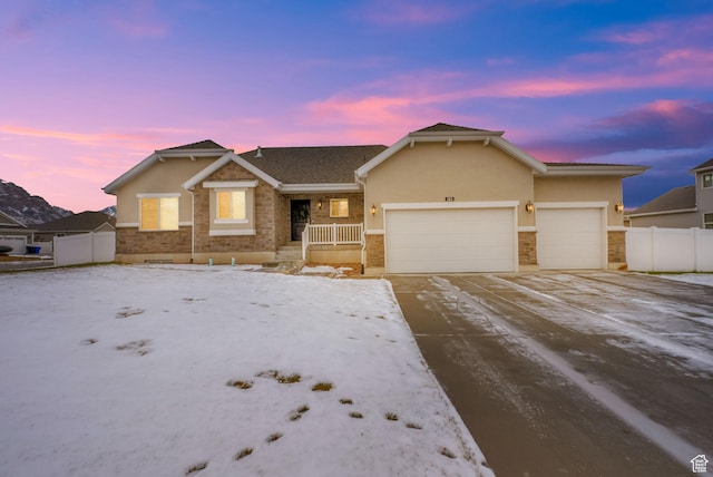 143 E 1825 N, North Ogden, UT 84414 - ranch-style house with stucco siding, a garage, driveway, and stone siding