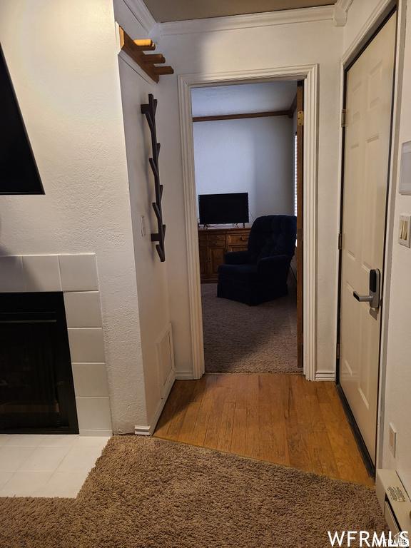 150 W Ridge View St Unit 215, Brian Head, UT 84719 - hall with wood finished floors, crown molding, and a baseboard heating unit