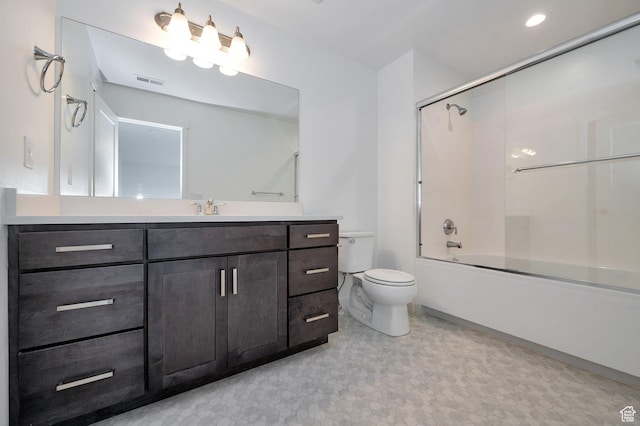 bathroom with tile patterned floors, toilet, visible vents, vanity, and enclosed tub / shower combo