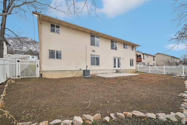 854 S 200 E, Farmington, UT 84025 - back of property with central AC unit, a patio, a fenced backyard, a gate, and french doors