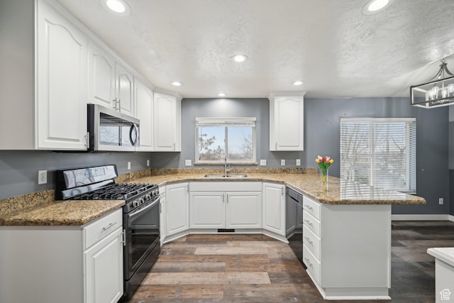 854 S 200 E, Farmington, UT 84025 - kitchen with stainless steel microwave, a sink, gas range, dishwasher, and a peninsula