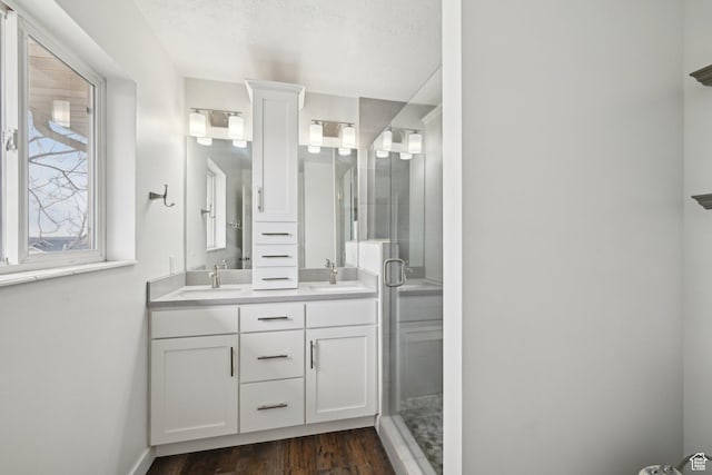 854 S 200 E, Farmington, UT 84025 - full bath with wood finished floors, a sink, a shower stall, and double vanity