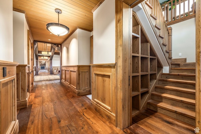 200 E 7000 S, Hyrum, UT 84319 - corridor with dark wood-type flooring, wainscoting, wooden ceiling, and stairs