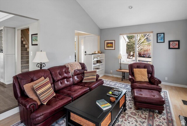 7996 S Sunnyoak Cir E, Cottonwood Heights, UT 84121 - living area with stairway, wood finished floors, and vaulted ceiling