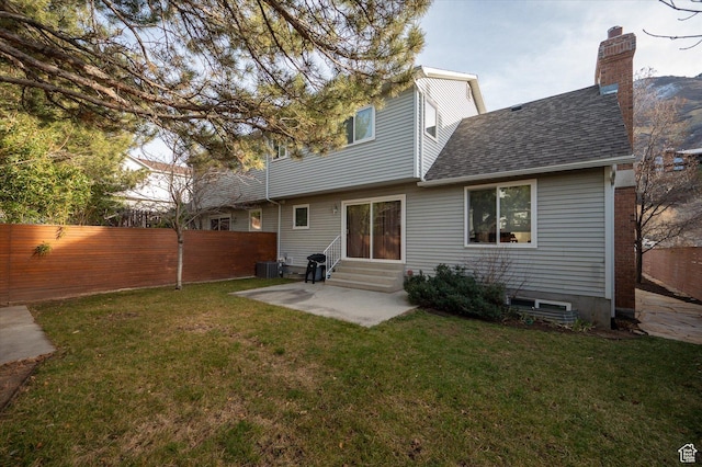 7996 S Sunnyoak Cir E, Cottonwood Heights, UT 84121 - rear view of property with a lawn, cooling unit, and a patio