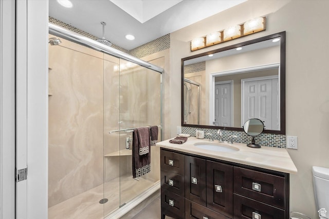 7996 S Sunnyoak Cir E, Cottonwood Heights, UT 84121 - bathroom with walk in shower, vanity, backsplash, and toilet