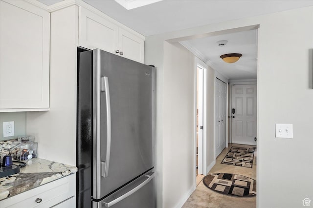 7996 S Sunnyoak Cir E, Cottonwood Heights, UT 84121 - kitchen with light stone countertops, light tile patterned floors, white cabinets, and stainless steel refrigerator