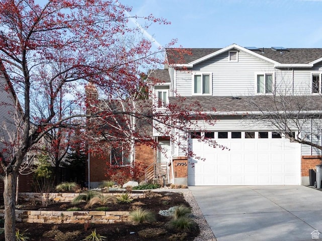 7996 S Sunnyoak Cir E, Cottonwood Heights, UT 84121 - view of front facade with a garage