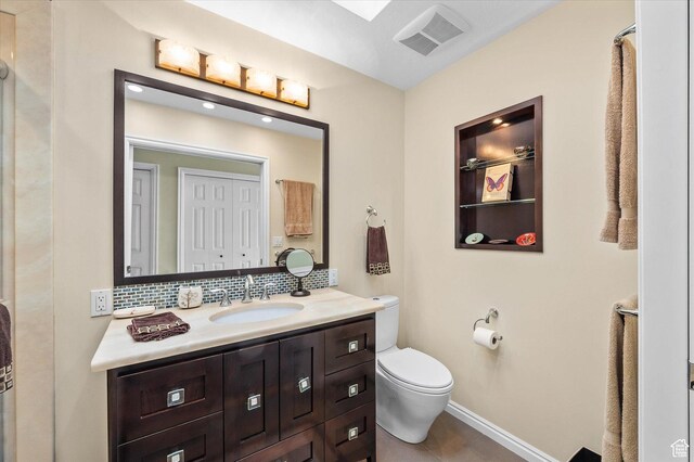 7996 S Sunnyoak Cir E, Cottonwood Heights, UT 84121 - bathroom with toilet, decorative backsplash, and vanity