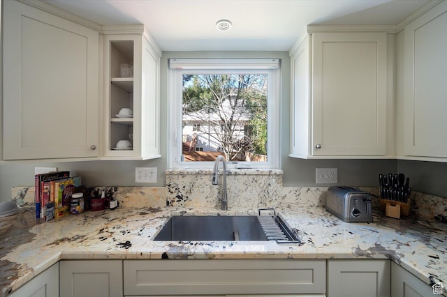 7996 S Sunnyoak Cir E, Cottonwood Heights, UT 84121 - kitchen featuring light stone countertops, sink, and white cabinetry