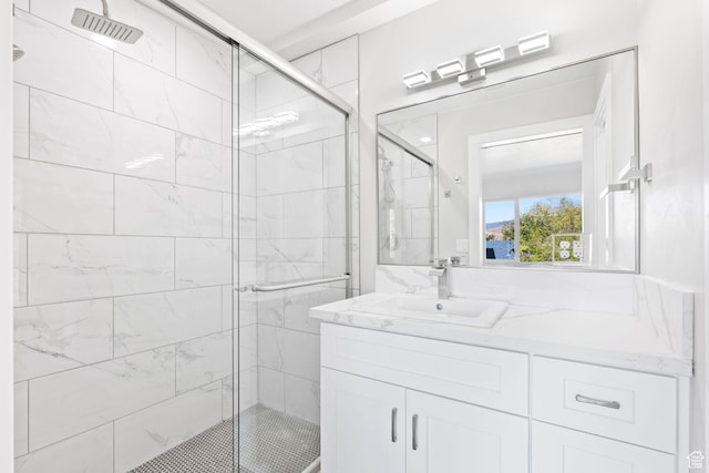 bathroom with vanity and an enclosed shower