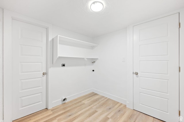 laundry room featuring light hardwood / wood-style flooring and electric dryer hookup