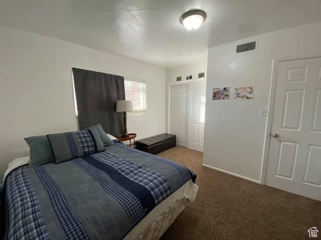 carpeted bedroom with a closet