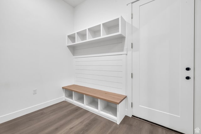 mudroom with wood finished floors and baseboards