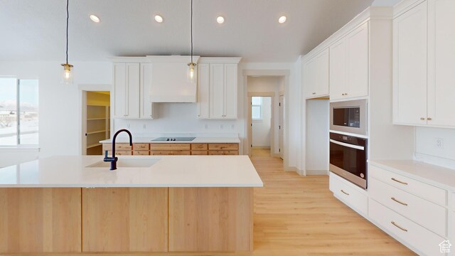 99 E 1590 S Unit 31, Salem, UT 84653 - kitchen featuring wall oven, a sink, black electric cooktop, light wood-style floors, and built in microwave