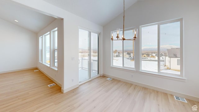 99 E 1590 S Unit 31, Salem, UT 84653 - unfurnished dining area featuring lofted ceiling, a chandelier, wood finished floors, and baseboards