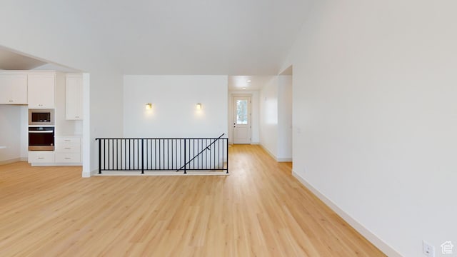 99 E 1590 S Unit 31, Salem, UT 84653 - unfurnished room featuring light wood finished floors, baseboards, and lofted ceiling