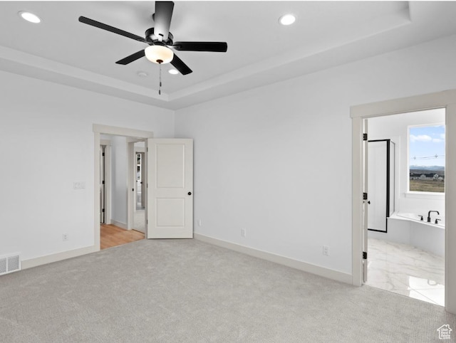 99 E 1590 S Unit 31, Salem, UT 84653 - unfurnished bedroom featuring light colored carpet, a tray ceiling, recessed lighting, baseboards, and ensuite bath
