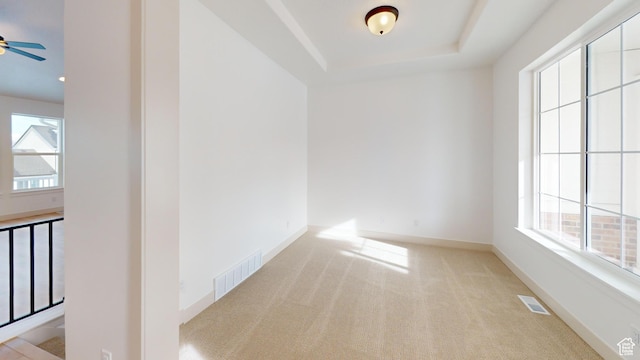 99 E 1590 S Unit 31, Salem, UT 84653 - spare room featuring carpet flooring, a ceiling fan, a tray ceiling, and baseboards