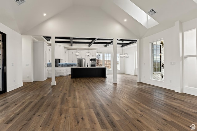 1539 W 2130th Cir S, St George, UT 84770 - unfurnished living room featuring a chandelier, a skylight, high vaulted ceiling, and dark wood-type flooring