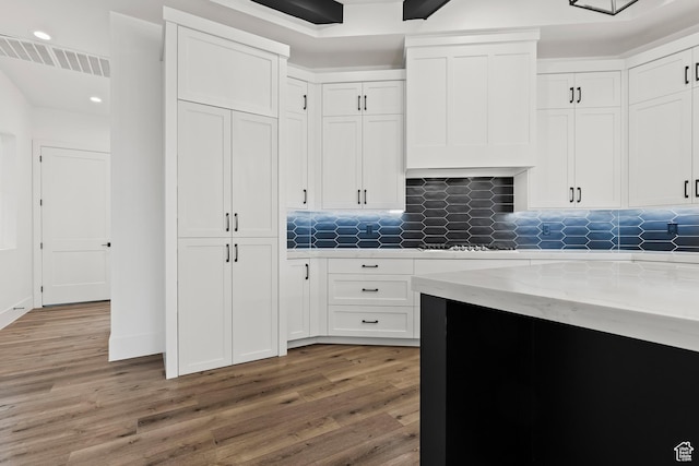1539 W 2130th Cir S, St George, UT 84770 - kitchen with wood-type flooring, backsplash, and white cabinetry