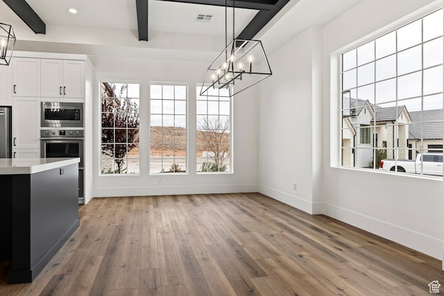 1539 W 2130th Cir S, St George, UT 84770 - unfurnished dining area featuring beamed ceiling, a chandelier, and light hardwood / wood-style flooring
