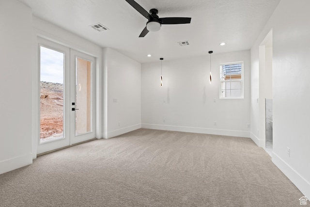 1539 W 2130th Cir S, St George, UT 84770 - unfurnished room featuring light carpet, french doors, and ceiling fan