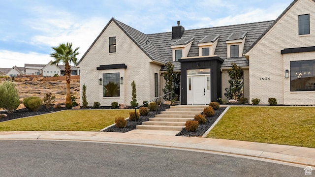 1539 W 2130th Cir S, St George, UT 84770 - view of front of property with a front yard, a chimney, and brick siding