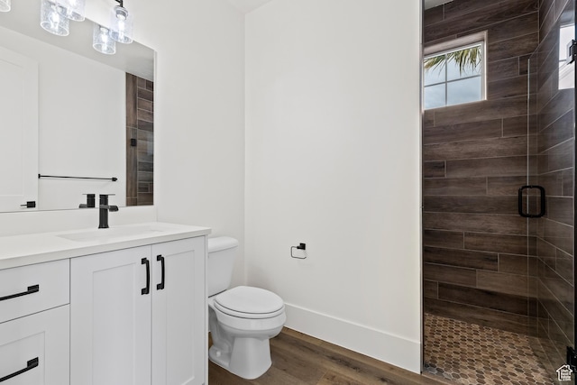 1539 W 2130th Cir S, St George, UT 84770 - bathroom featuring hardwood / wood-style floors, vanity, a shower with shower door, and toilet