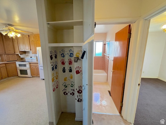 interior space with light carpet and baseboards