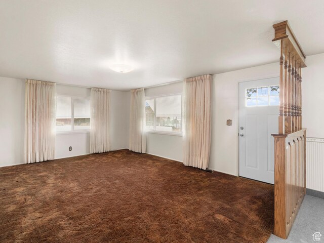 5304 W 20400 N, Plymouth, UT 84330 - foyer featuring dark colored carpet