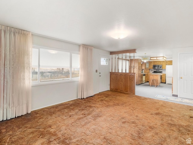 5304 W 20400 N, Plymouth, UT 84330 - unfurnished living room with light carpet