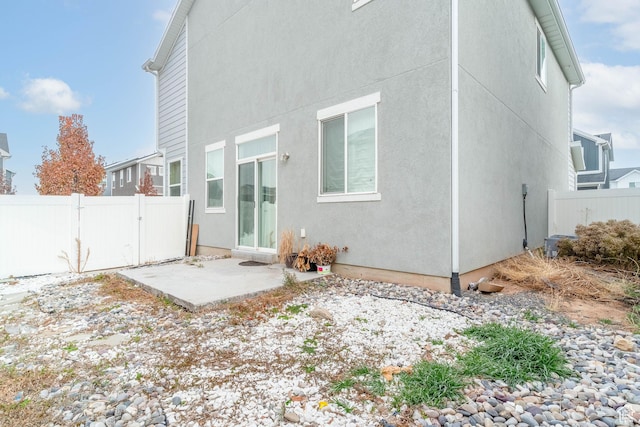 rear view of property featuring a patio