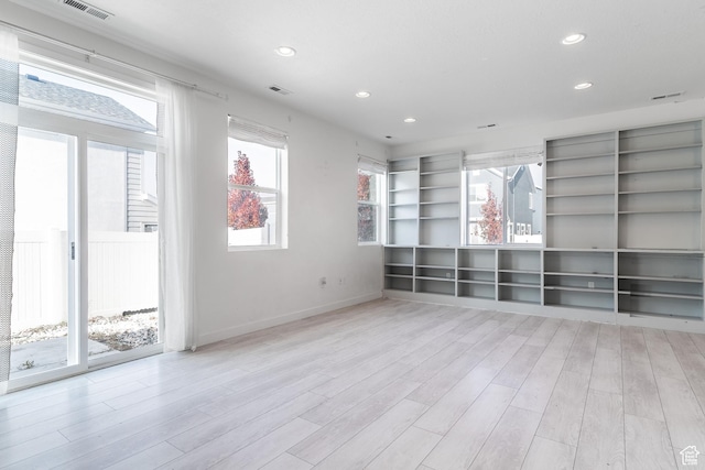 unfurnished room featuring light wood-type flooring