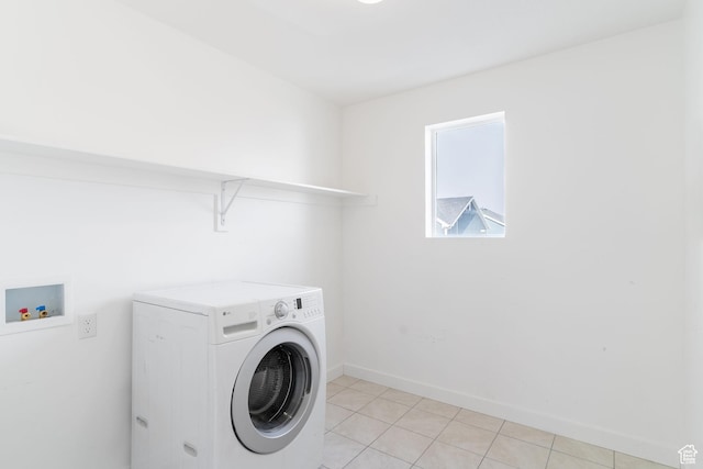 washroom featuring light tile patterned floors and washer / clothes dryer