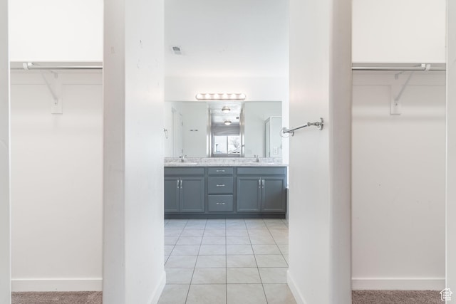 bathroom featuring tile patterned flooring and vanity