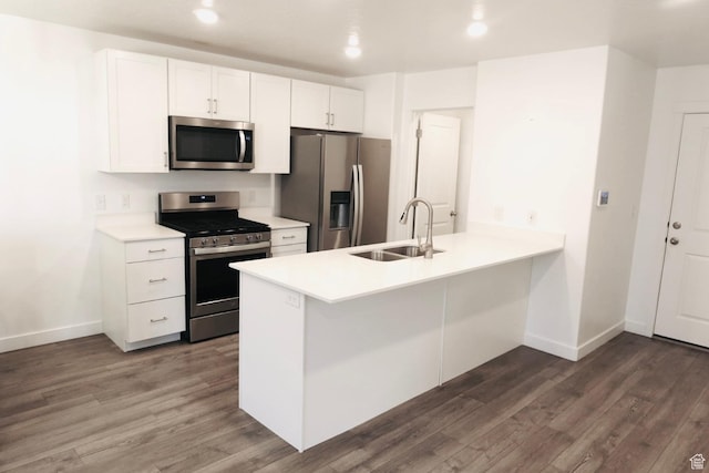 54 N Heading Row, Saratoga Springs, UT 84045 - kitchen featuring kitchen peninsula, appliances with stainless steel finishes, dark hardwood / wood-style flooring, sink, and white cabinetry