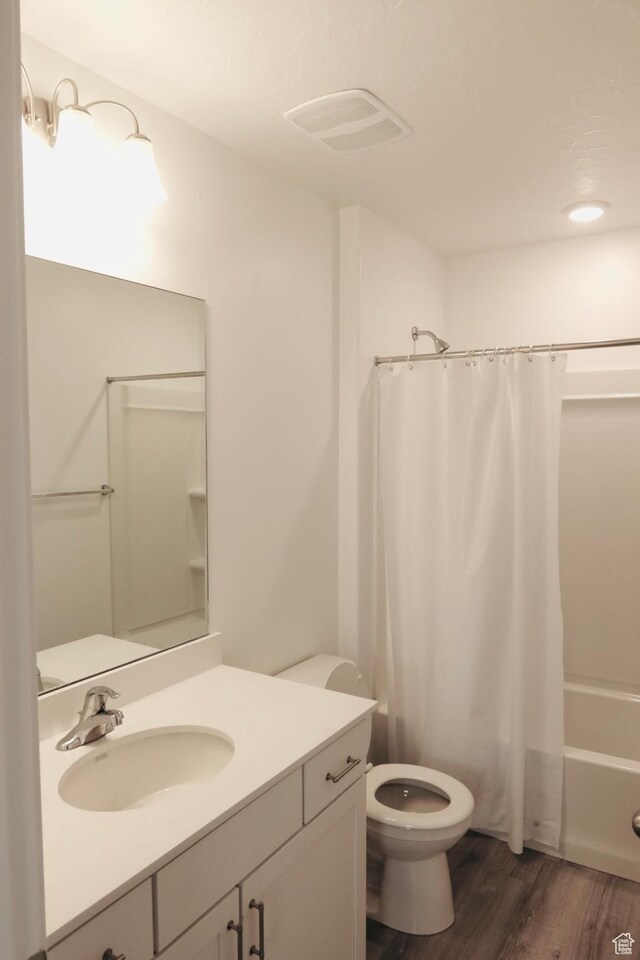 54 N Heading Row, Saratoga Springs, UT 84045 - full bathroom featuring shower / tub combo, vanity, hardwood / wood-style flooring, and toilet