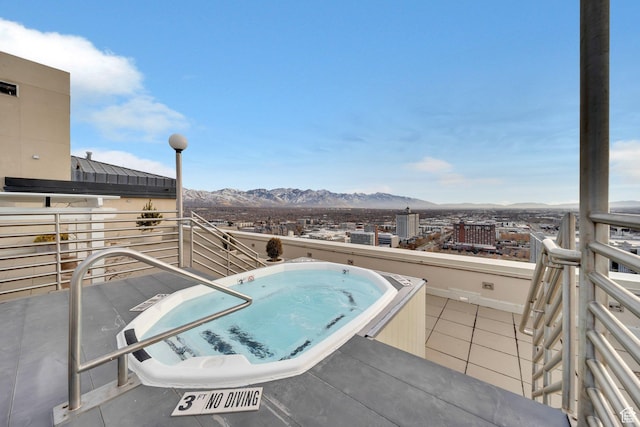 44 W 300 S Unit 2306S, Salt Lake City, UT 84101 - view of patio with a mountain view, a balcony, and an in ground hot tub