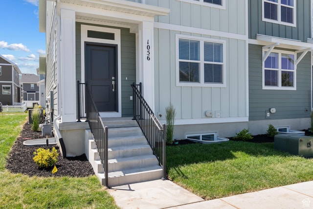 1056 E 1930 S Unit 420, Heber City, UT 84032 - entrance to property with board and batten siding and a lawn