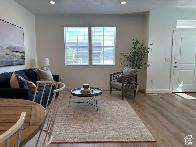 1056 E 1930 S Unit 420, Heber City, UT 84032 - living area with wood finished floors and recessed lighting