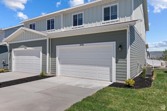 1056 E 1930 S Unit 420, Heber City, UT 84032 - view of front of house featuring board and batten siding, an attached garage, and driveway