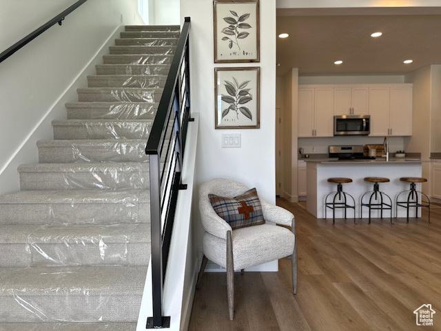 1056 E 1930 S Unit 420, Heber City, UT 84032 - stairs with wood finished floors and recessed lighting