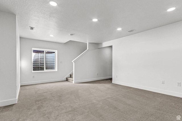 1056 E 1930 S Unit 420, Heber City, UT 84032 - unfurnished living room featuring recessed lighting, carpet, stairs, and a textured ceiling