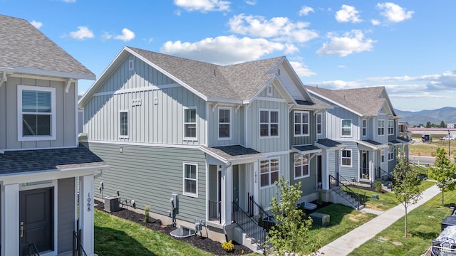 1056 E 1930 S Unit 420, Heber City, UT 84032 - view of home's exterior with board and batten siding, roof with shingles, a mountain view, and a yard