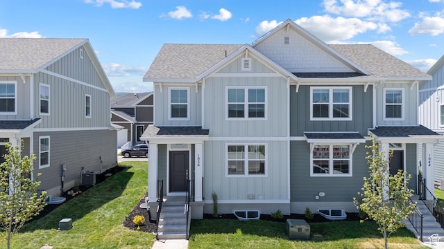 1056 E 1930 S Unit 420, Heber City, UT 84032 - view of front facade with board and batten siding, a shingled roof, and a front lawn