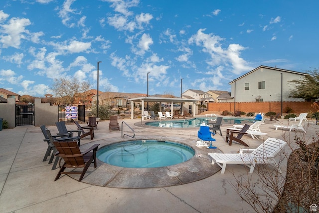 443 N Puerta Dr, Washington, UT 84780 - view of pool featuring a patio area and a hot tub